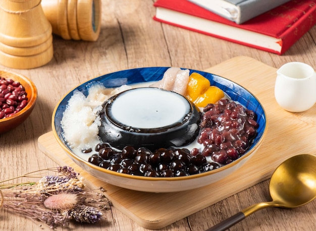 Grass Jelly Panna Cotta served in bowl isolated on table top view of asian food