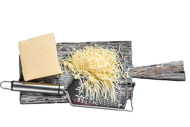 Grated cheese for cooking on a cutting board Isolated white background