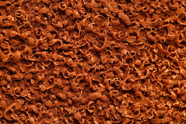 Grated chocolate flakes Macro chocolate background top view Top of cake