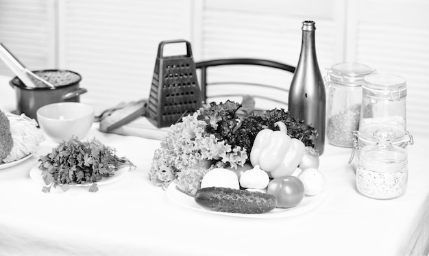 Grater and bottle near vegetables Vegetables easy meal Healthy dish Greenery lettuce cabbage broccoli fresh vegetables and cooking utensils close up This is what we need to cook healthy meal