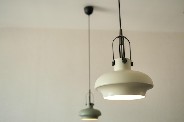 Gray ceiling lamp hanging in a room