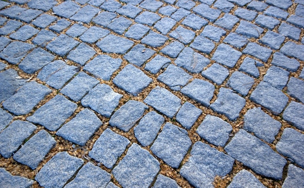 Gray cobbled road as background