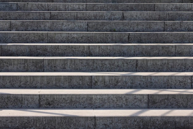 Gray concrete high stairs background or texture