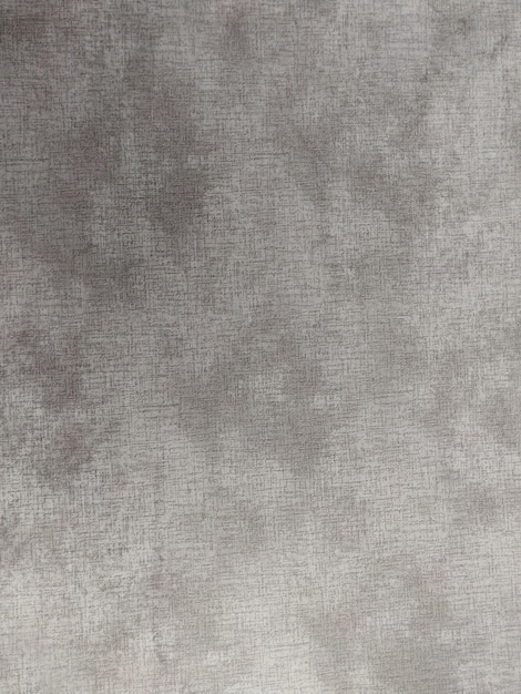 A gray fabric with a stain on it.