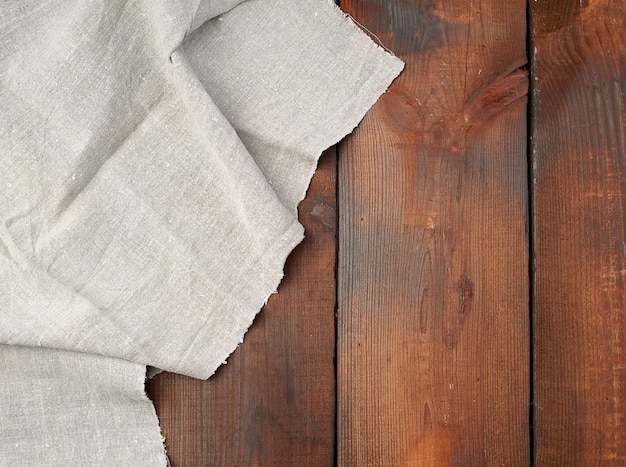 Gray linen towel on wooden table