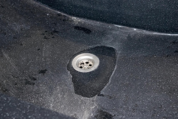 Gray old marble sink in toilet closeup