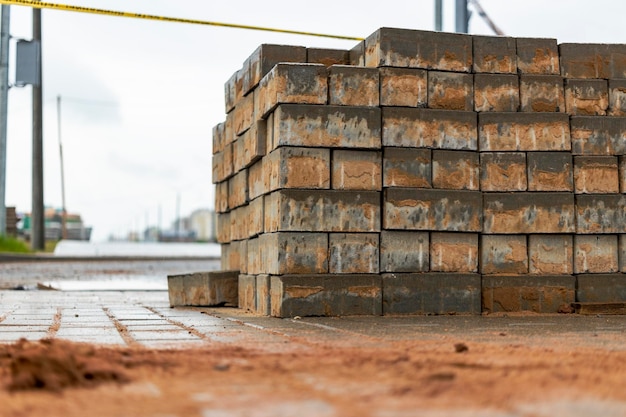 Gray paving slabs at a construction site Material for paving roads and sidewalks Closeup Concrete tiles