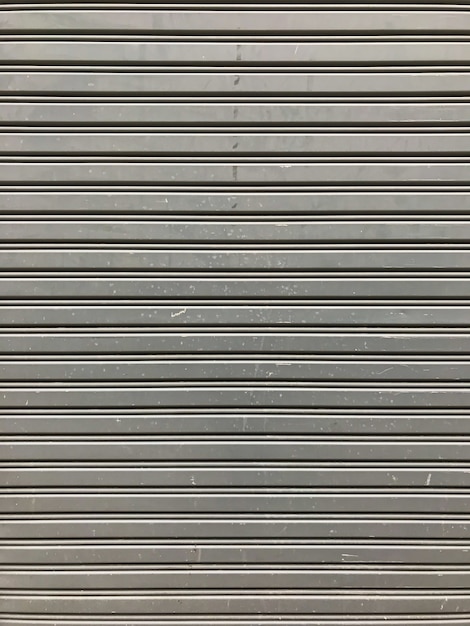 Gray Rustic store retail metal gate wall closed.