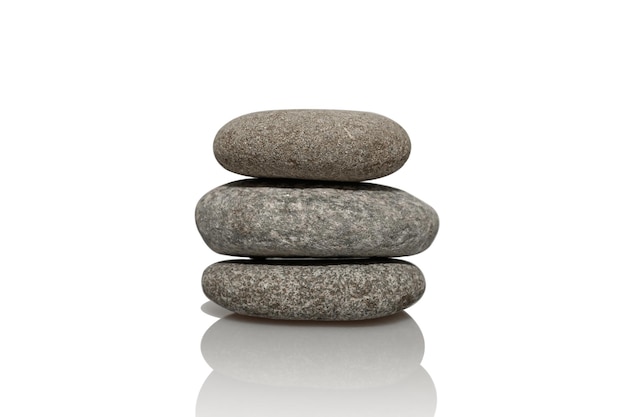 Gray smooth round stones on a white background Natural stones