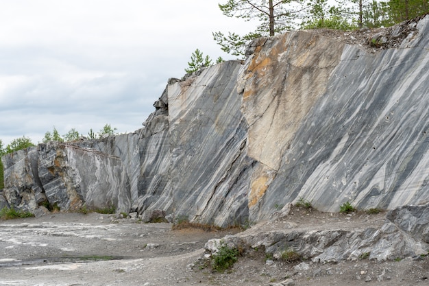 Gray surface of marble stone with striped streaks.