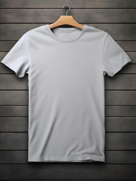 a gray t - shirt hangs on a wooden hanger.