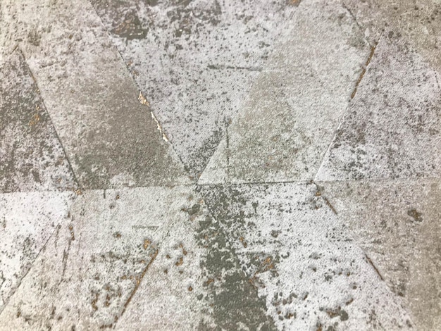 Gray texture ornament on the tiles pattern and stains on the tiles in the bathroom and toilet tiles