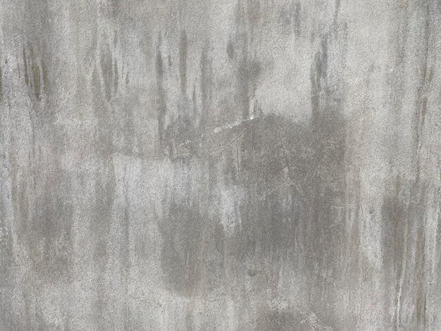 A gray textured background with a water droplet on it.