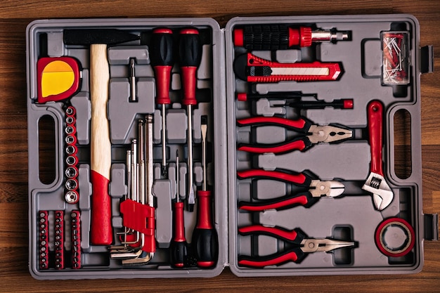 Gray tool box with red tools top view