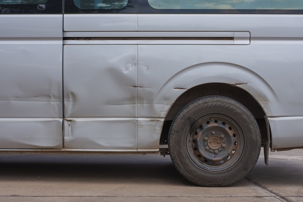 The gray van has collapsed patches but not much. 