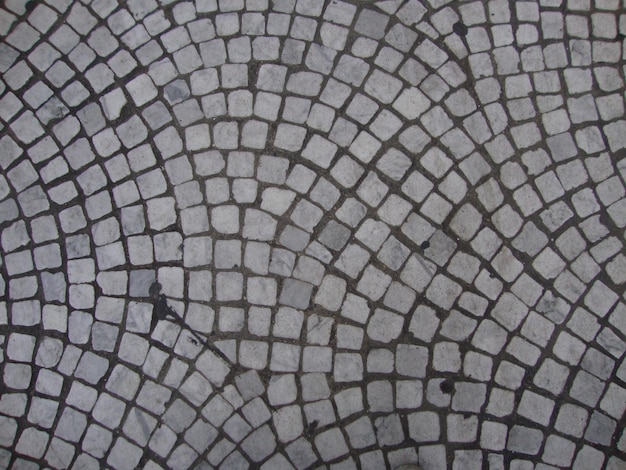 A gray and white cobblestone pattern with the word " on it. "