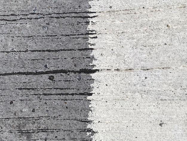 A gray and white rug with black lines on it.