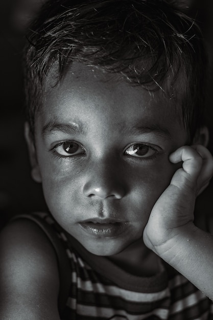 Grayscale closeup shot of a baby boy