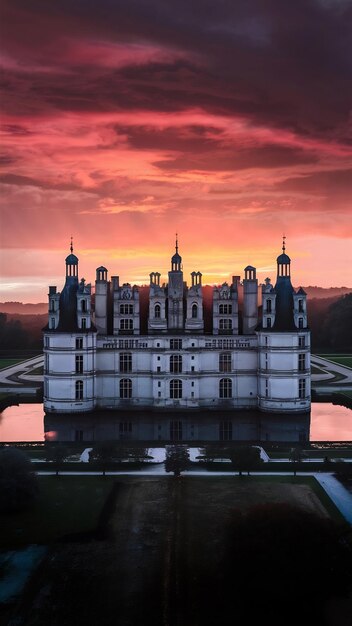 Great beautiful castles and heritage of France Chateau de Chantilly over sunset