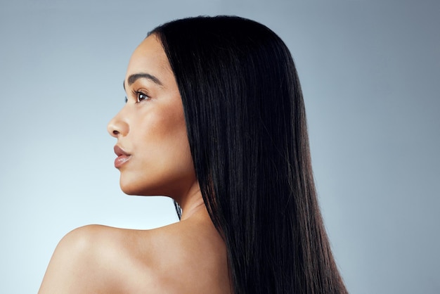 A great hairstyle is the best accessory Studio shot of an attractive young woman posing against a grey background