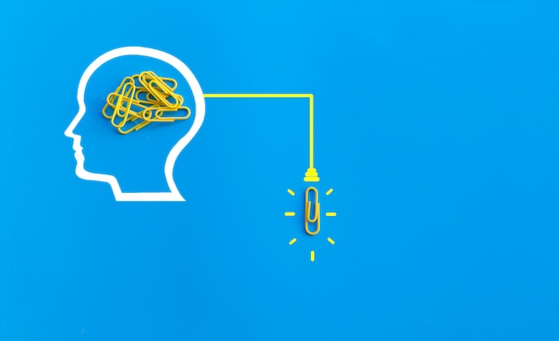 Great ideas concept with human brain, paperclip,thinking,creativity,light bulb on blue background,new ideas concept