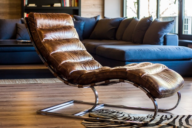 Great room of a hotel with a brown leather chair