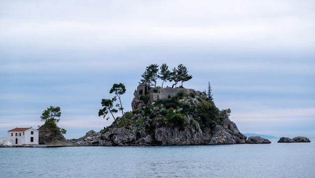 Greece Parga Panagia island off the coast of Parga small chapel and trees on the rock