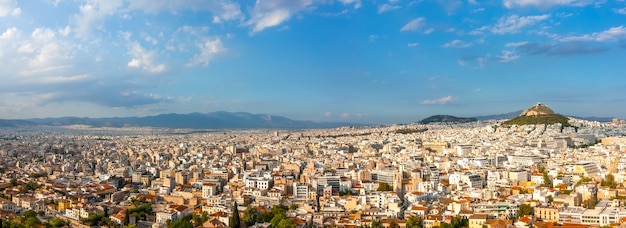 Greece. Summer sunny day in Athens. Panorama. Lots of rooftops and Lycabettus hill