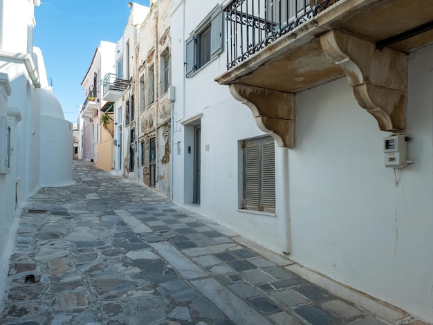 Greece Tinos island Chora town Cyclades Whitewashed houses cobblestone alleys blue sky