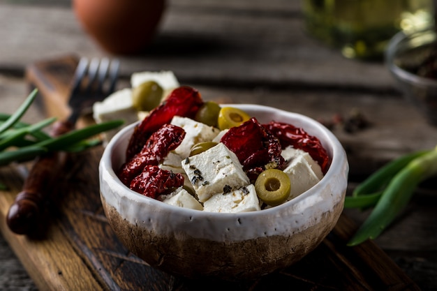 Greek cheese feta with herbs and olives, sundried tomatoes. 