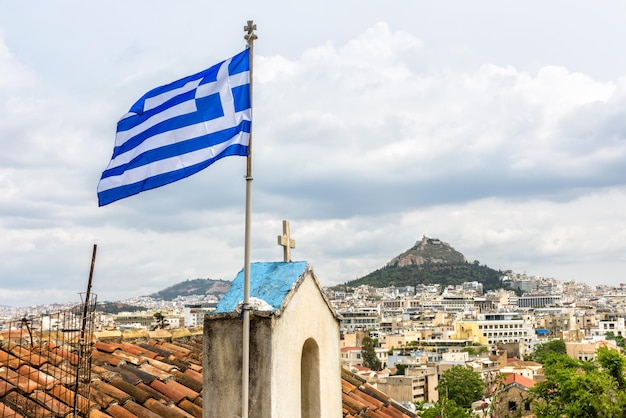 Greek flag in Athens view of Lycabettus mount from Acropolis foot Greece