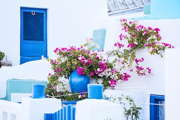 Greek House with Blue Door and Colorful Flowers, Greece