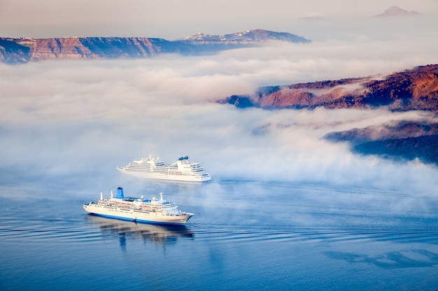 Greek islands in the morning fog, Santorini, Greece