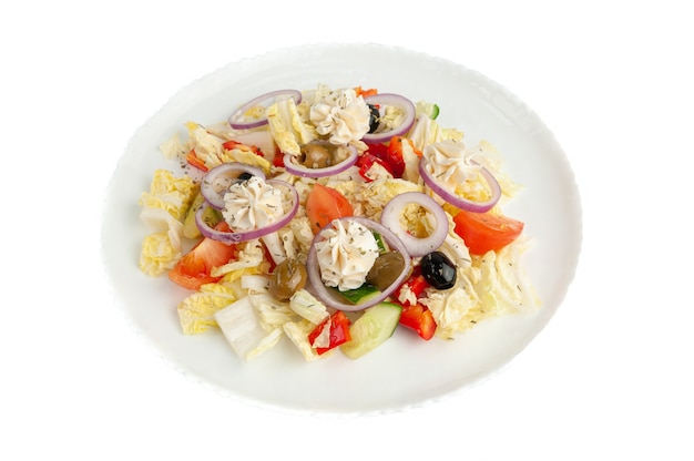 Greek salad with Chinese cabbage and curd cheese. Close-up, top view. White background.