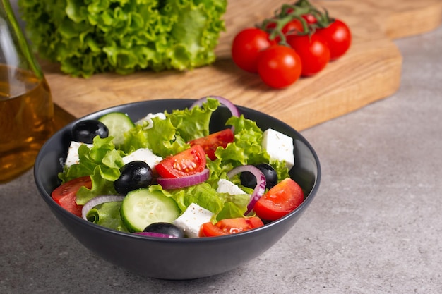 Greek salad with delicious rucola, spinach, arugula, feta cheese, cucumber, red onion and cherry