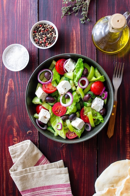 Greek salad with feta cheese tomatoes cucumbers peppers and Kalamata olives Healthy eating Vegetarian food