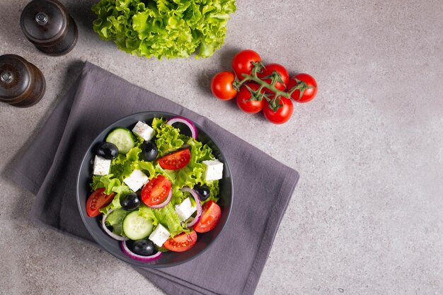 Greek salad with fresh tomatoes cucumber olives feta cheese and red onion Healthy and diet food concept