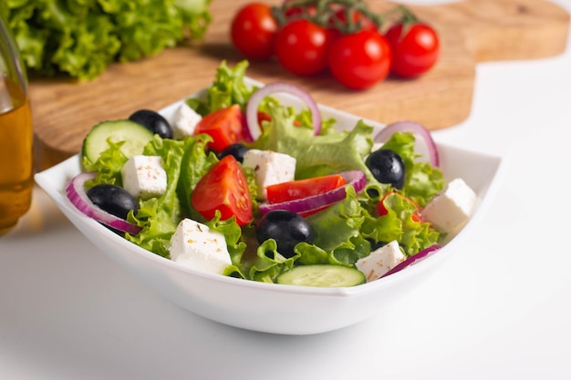 Greek salad with fresh tomatoes cucumber olives feta cheese and red onion Healthy and diet food concept