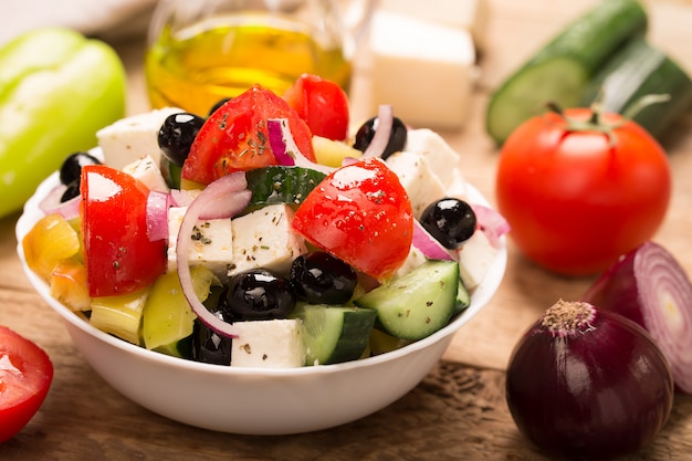 Greek salad with fresh vegetables, feta cheese and black olives. Horizontal