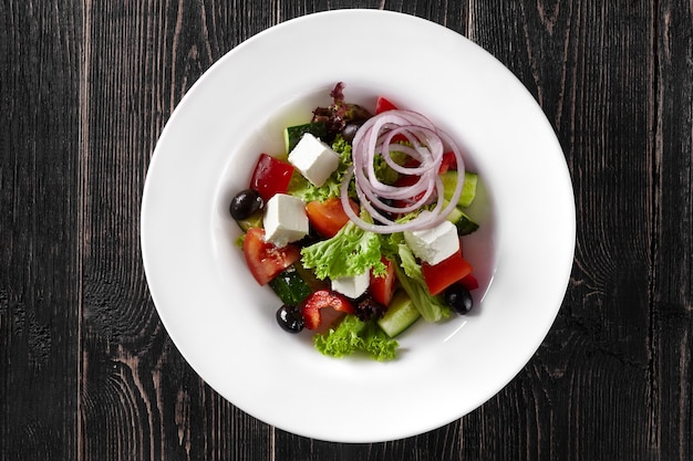 Greek salad with fresh vegetables feta cheese and black olives