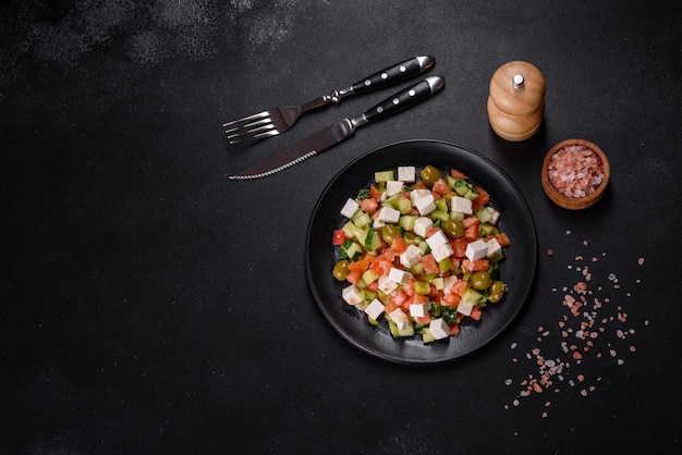 Greek salad with juicy tomatoes feta cheese lettuce green olives cucumber red onion and fresh parsley