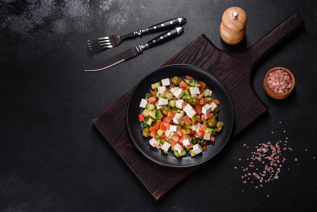 Greek salad with juicy tomatoes feta cheese lettuce green olives cucumber red onion and fresh parsley