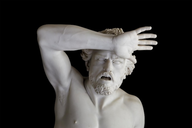 Greek sculpture of a man with raised hand and open mouth isolated on black background