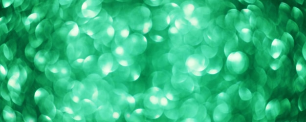 Green abstract background defocus lights round Blurry glitter background