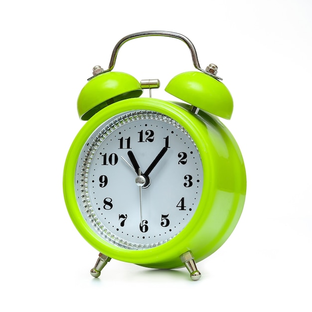 Green alarm clock in retro style on white background, isolate