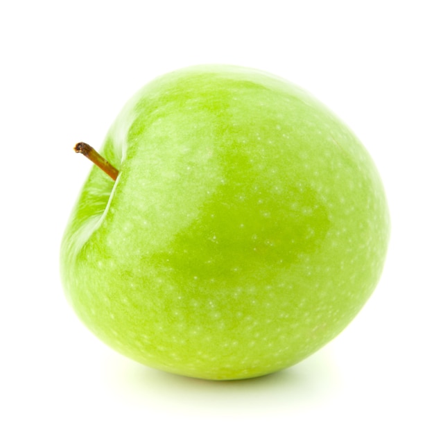 Green apple on a white with a shadow.