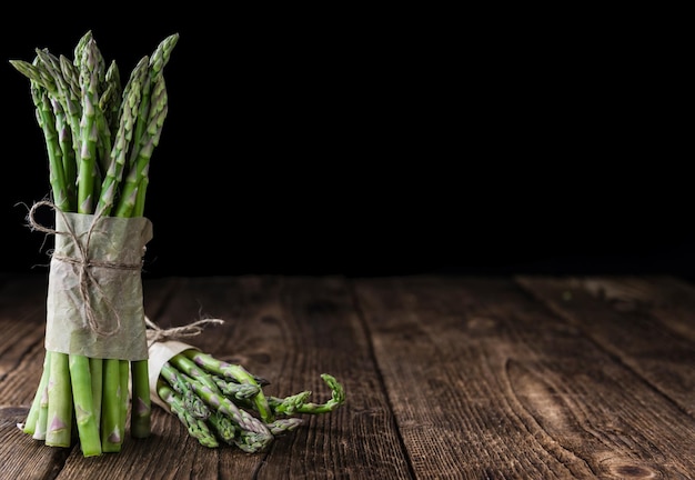 Green Asparagus closeup shot on wood