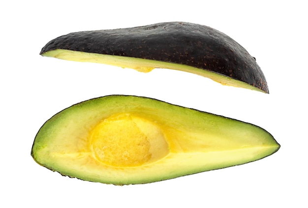 Green avocado two slices isolated