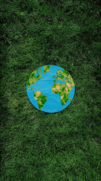 Photo a green background with a blue globe on it