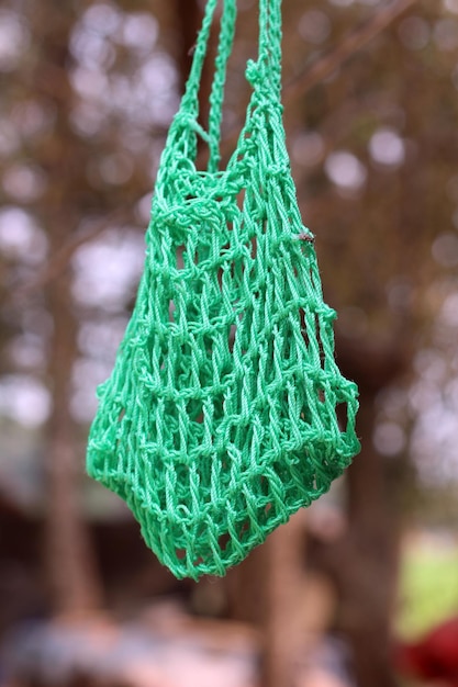 A green bag with the word bag on it